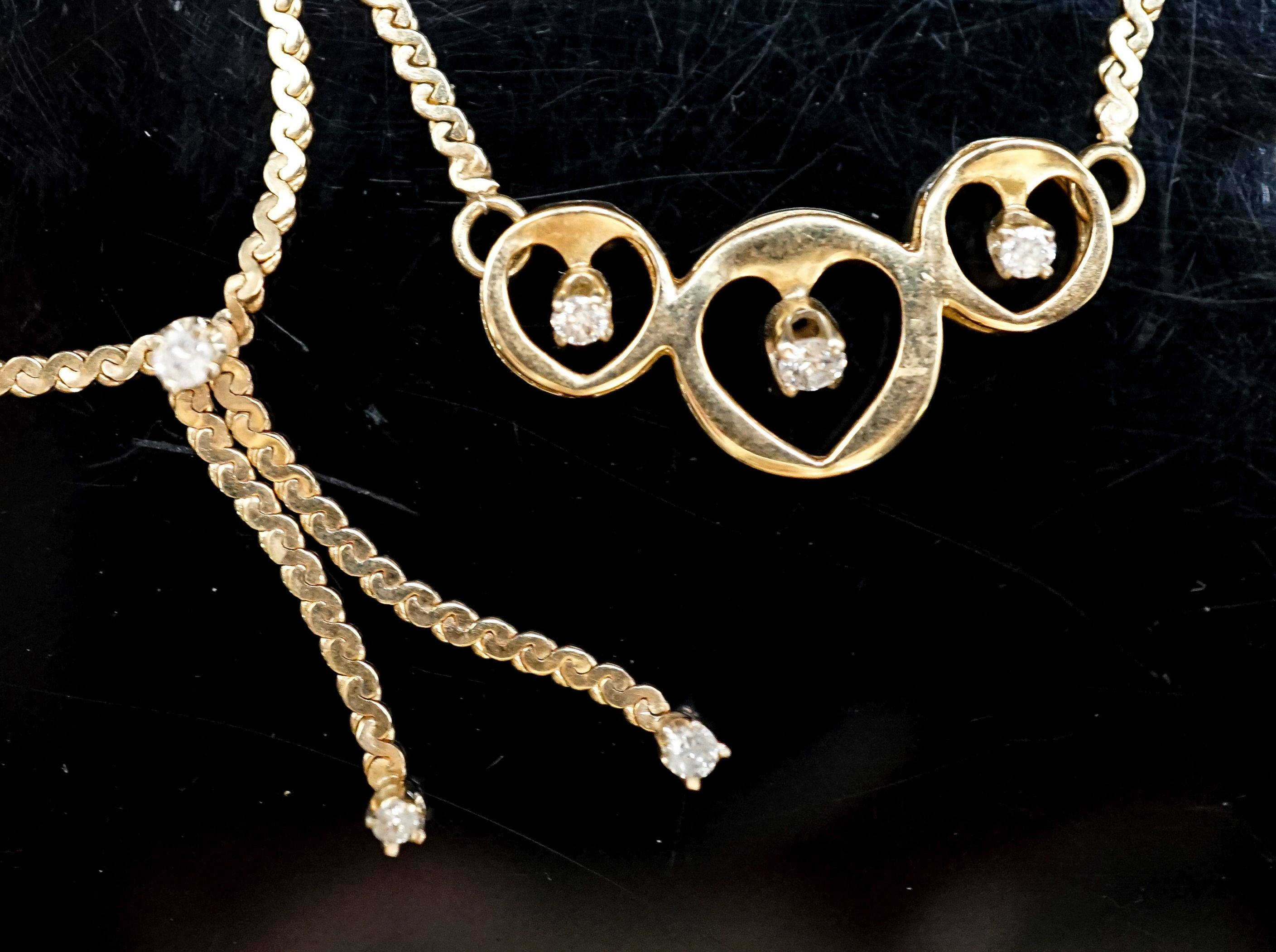 Two modern 14k and diamond chip set necklaces, gross weight 7.7 grams.